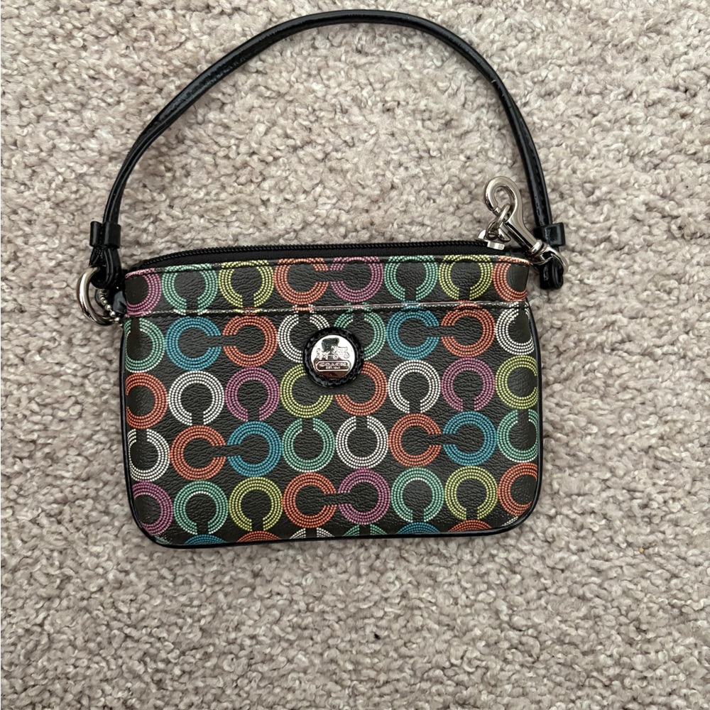 Coach small black and colorful wristlet 6” x 4” zipper.  Gently used